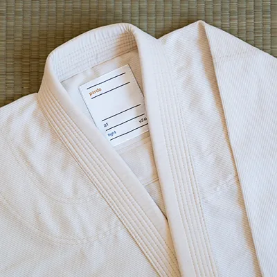 Close-up of the pardo label sewn inside an unbleached gi collar