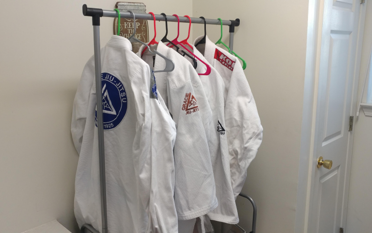 BJJ gis on a drying rack