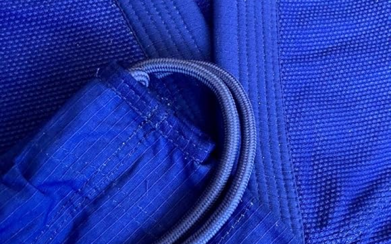 Close-up photo of a BJJ gi including ripstop pants and pearl weave jacket